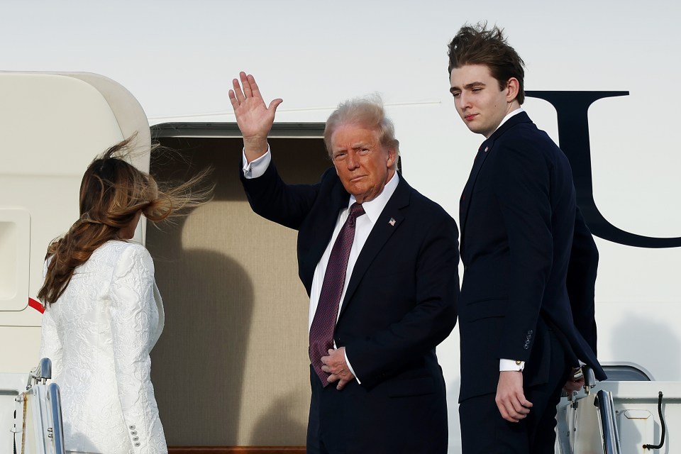 Donald Trump, Melania Trump, and Barron Trump boarding an Air Force aircraft.