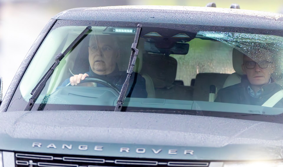 Prince Andrew driving a Range Rover.