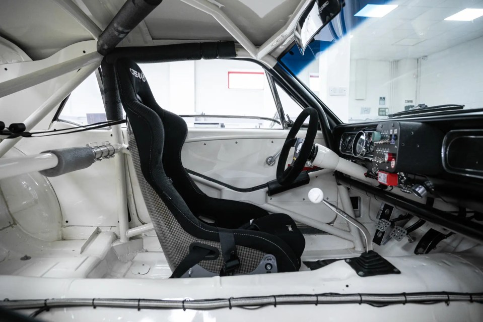 Interior of a white 1966 Ford Mustang race car.