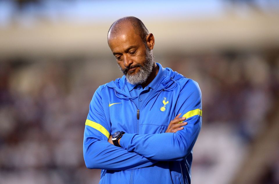 Nuno Espírito Santo, Tottenham Hotspur manager, looking down with arms crossed.