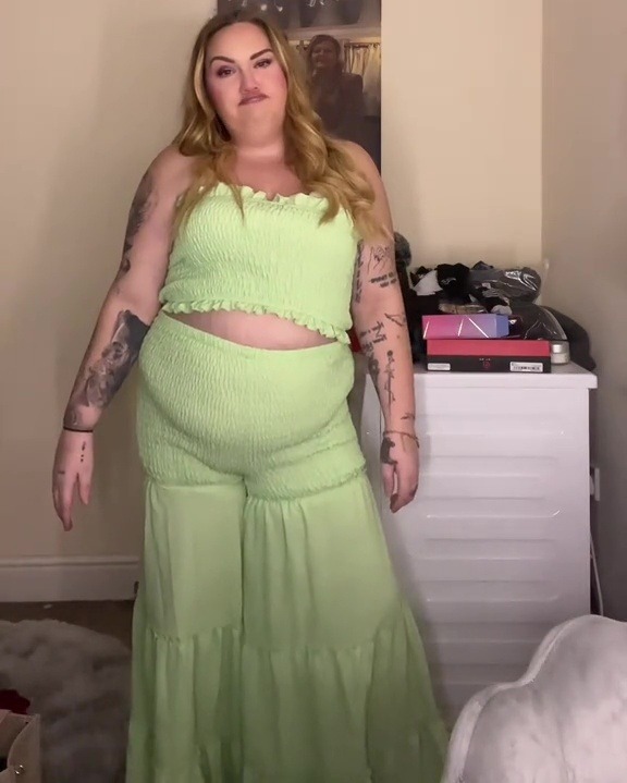 Woman modeling a light green co-ord set.