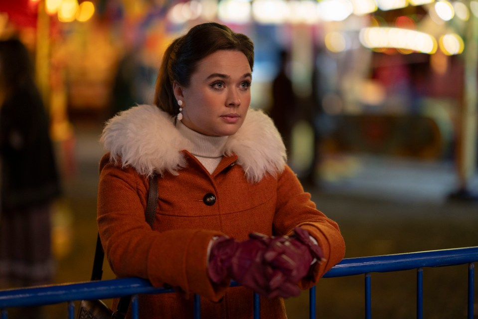 Nancy Corrigan from Call the Midwife Christmas special, wearing an orange coat.