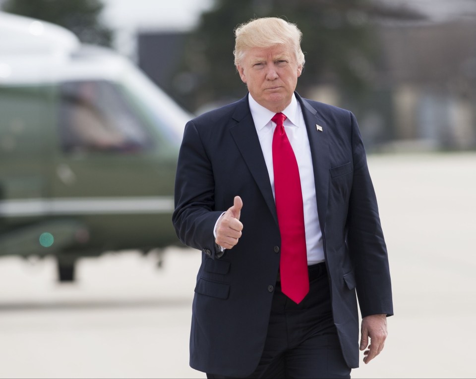 Donald Trump giving a thumbs-up.