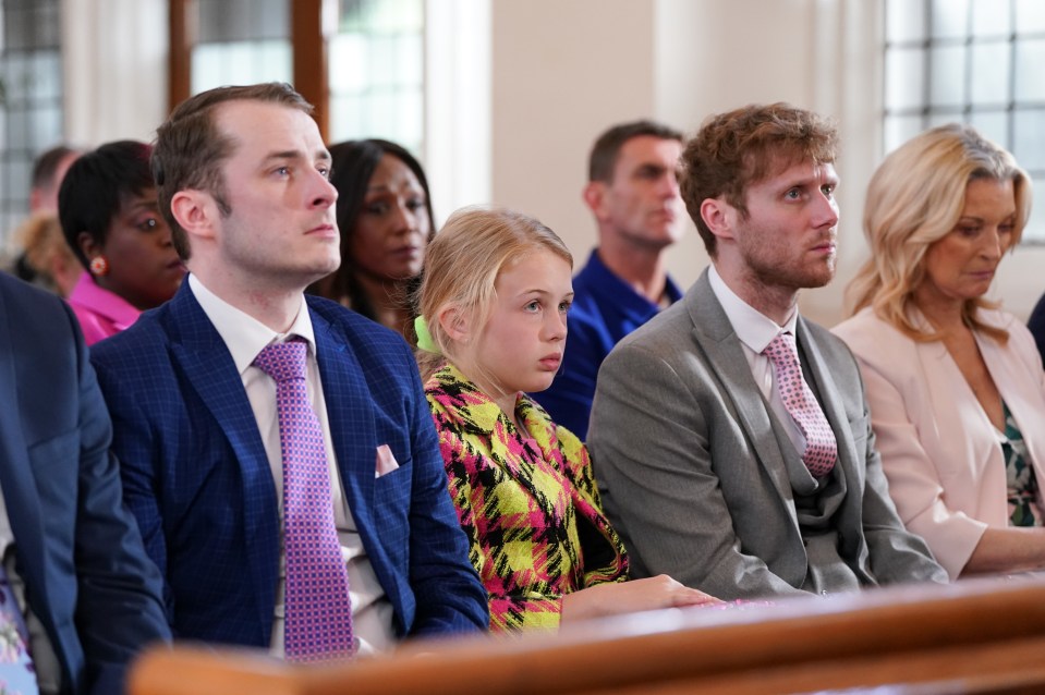 EastEnders cast members at a wedding.