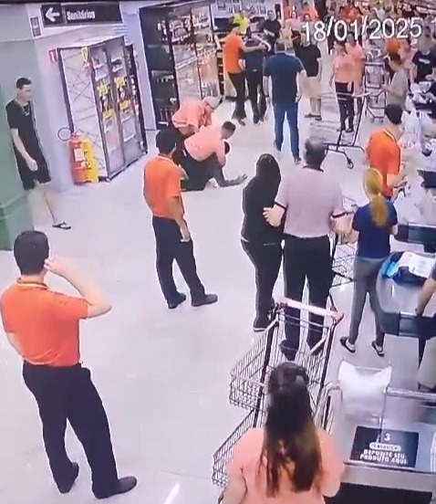 CCTV footage of a man hitting a supermarket manager in the head with a shovel.