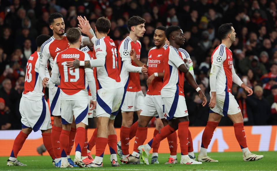 Arsenal FC players celebrating a goal.