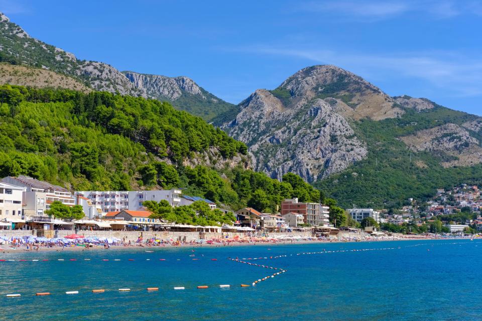 Beach in Sutomore, Montenegro, with mountains in the background.