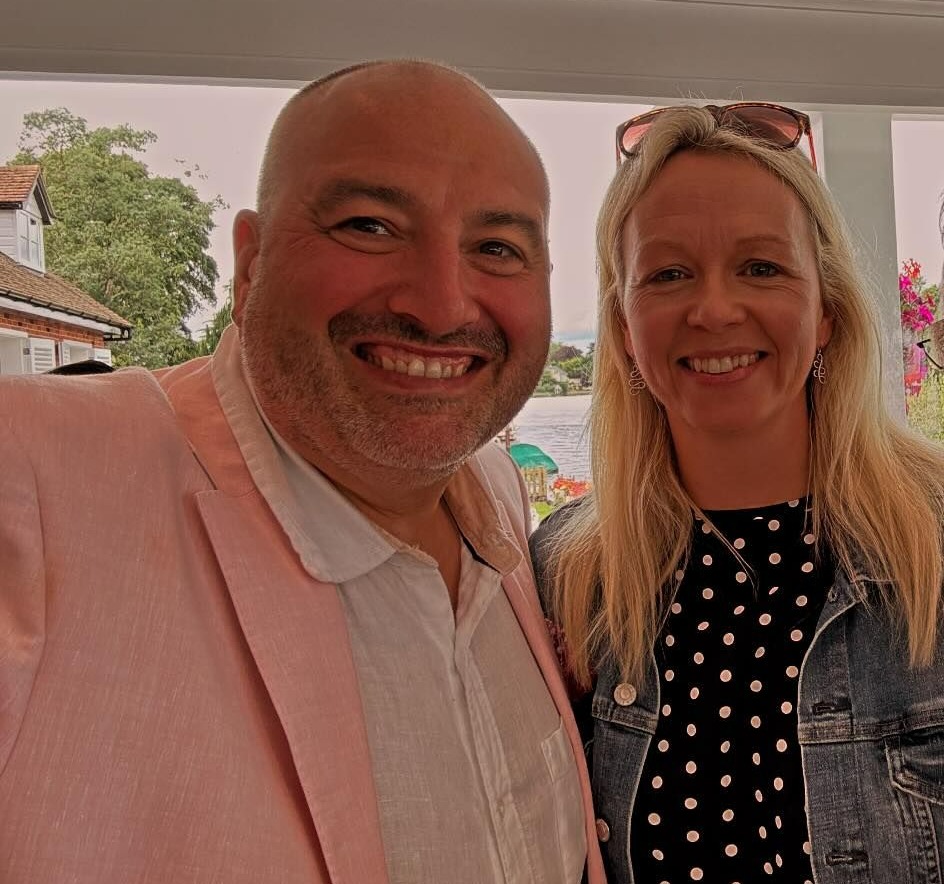 Three people smiling for a photo.