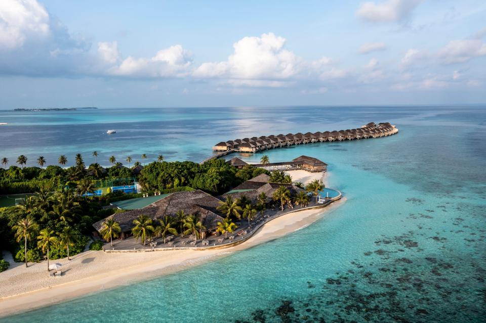 Aerial view of a Maldivian resort on a tropical island.