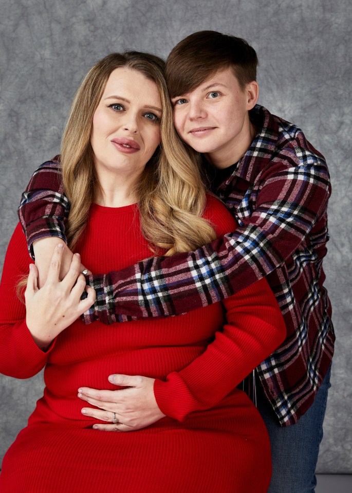 Pregnant woman embraced by a shorter person.