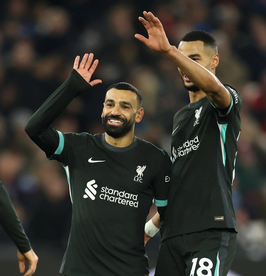 Mohamed Salah and Liverpool teammates celebrating a goal.