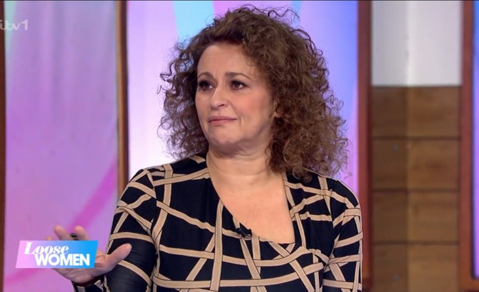 A woman with curly brown hair speaks on Loose Women.