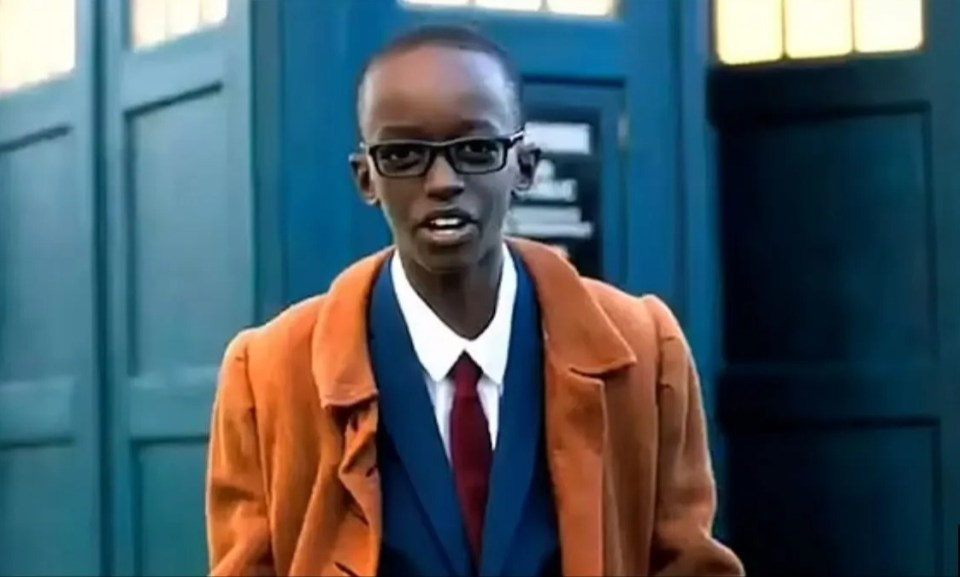 Axel Rudakubana, age 11, in a promotional video, wearing a brown coat and tie.