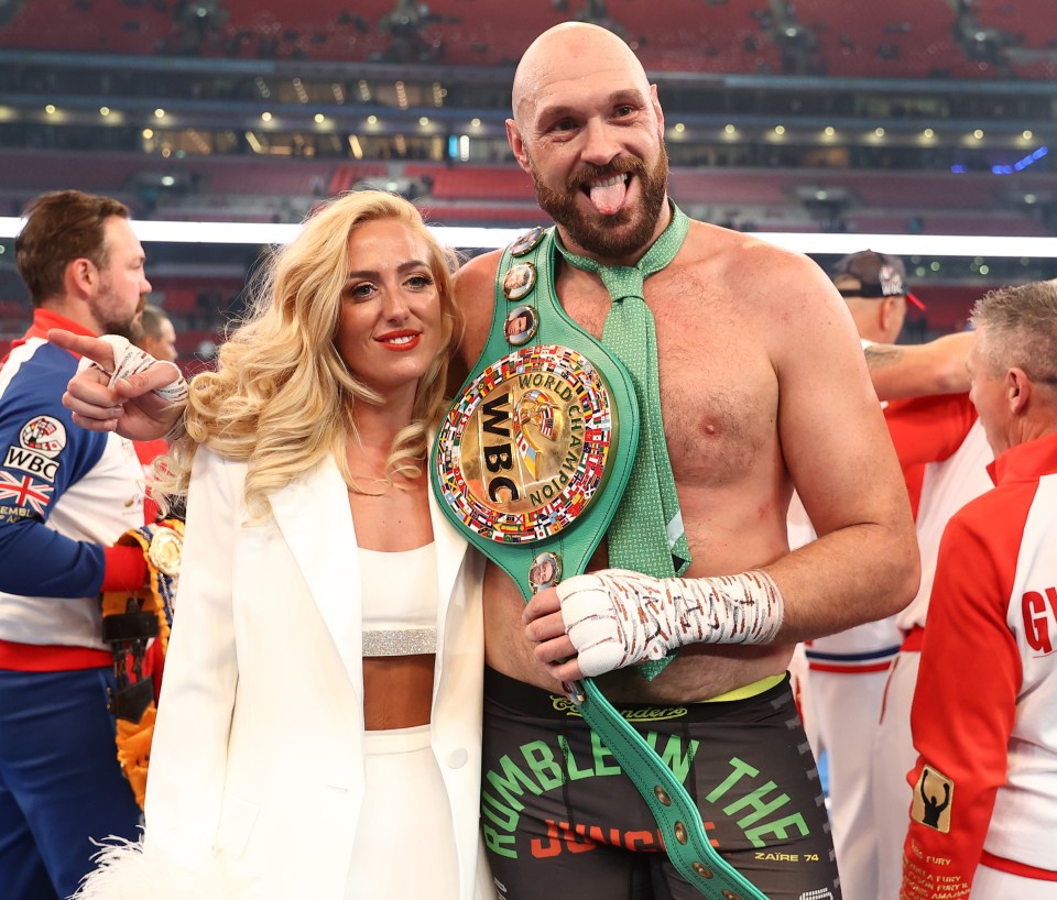 Tyson Fury and his wife Paris with the WBC Heavyweight Championship belt.