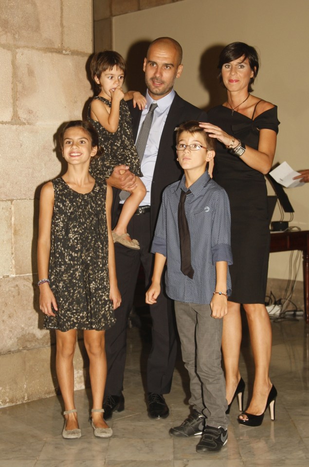 Pep Guardiola with his family at an award ceremony.