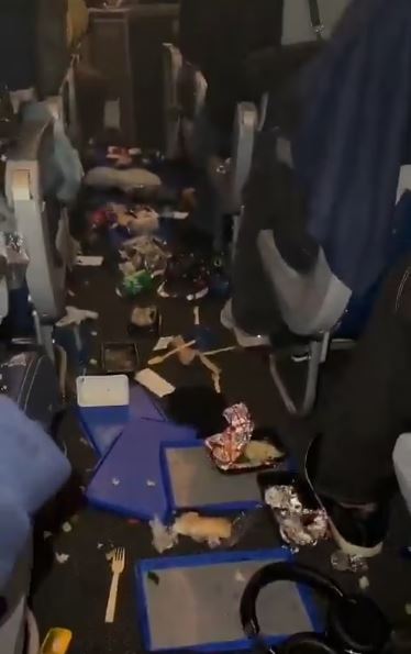 Messy airplane cabin after mid-air turbulence.