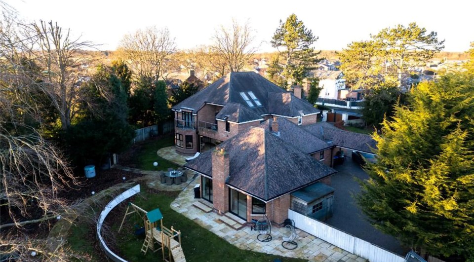 Aerial view of Charlotte Crosby's mansion, featuring a cinema, gym, and swimming pool.