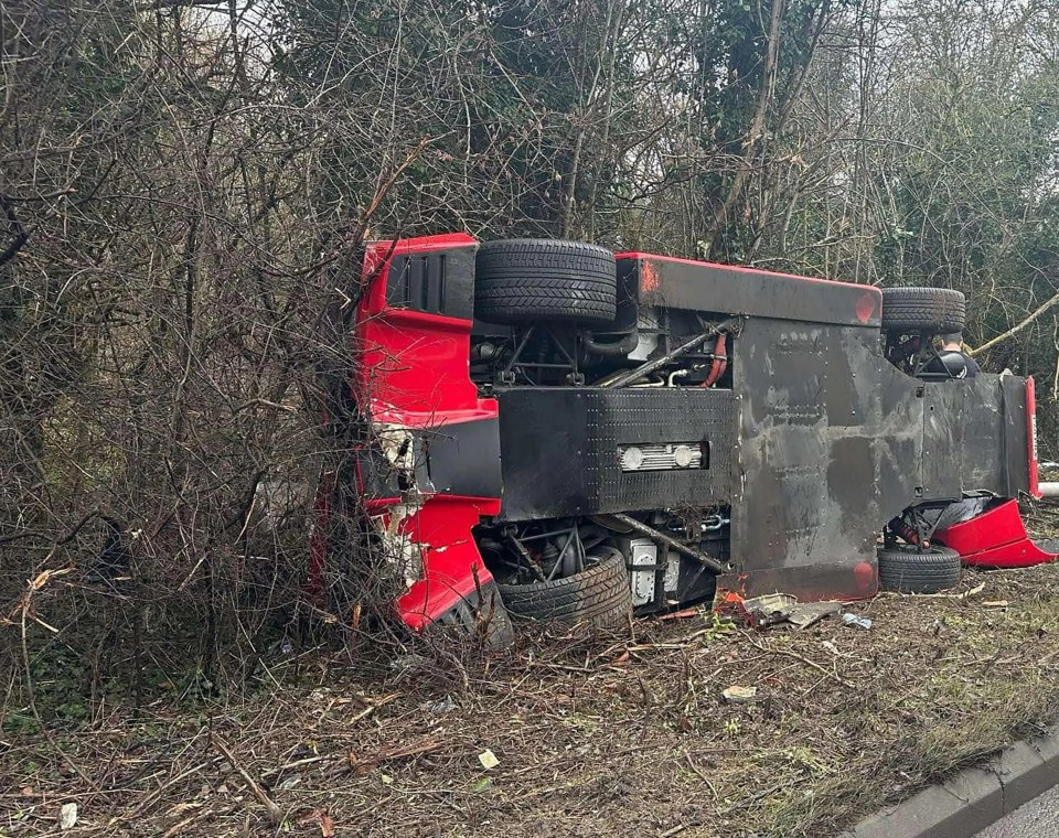 Wreckage of a red Ferrari after a crash.