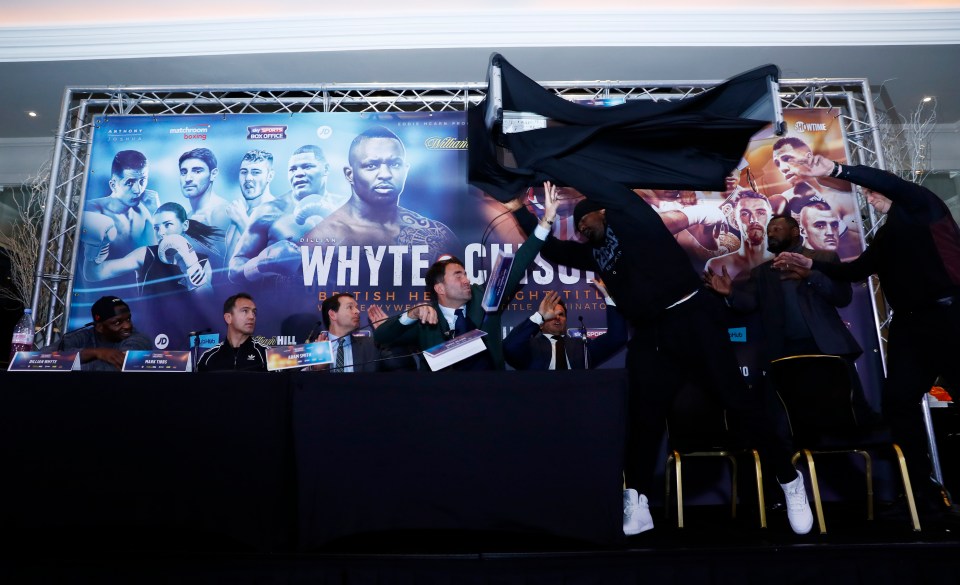 Dereck Chisora throwing a table at a boxing press conference.