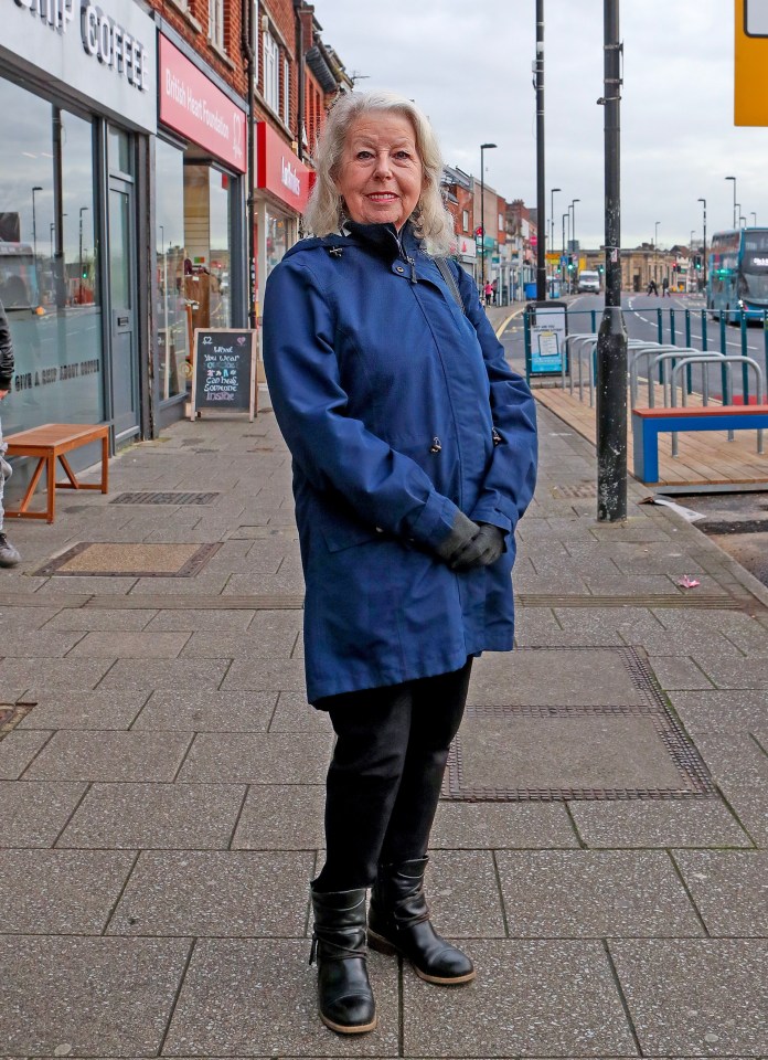 A woman on a city street comments on a new traffic scheme.