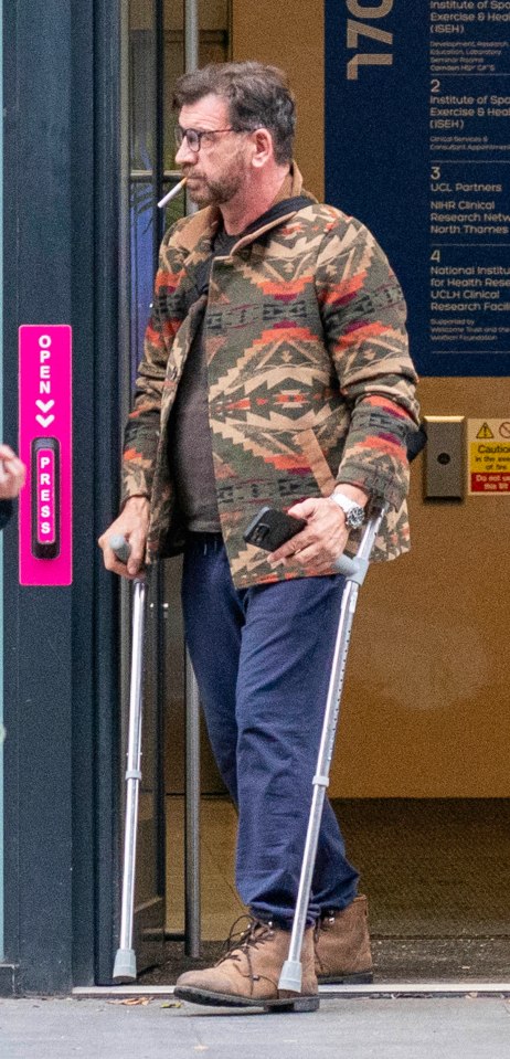 Man on crutches leaving a sports injury clinic.