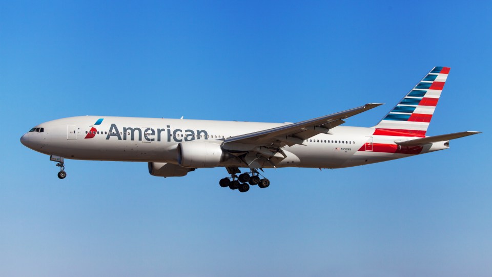 American Airlines Boeing 777-200ER approaching an airport.