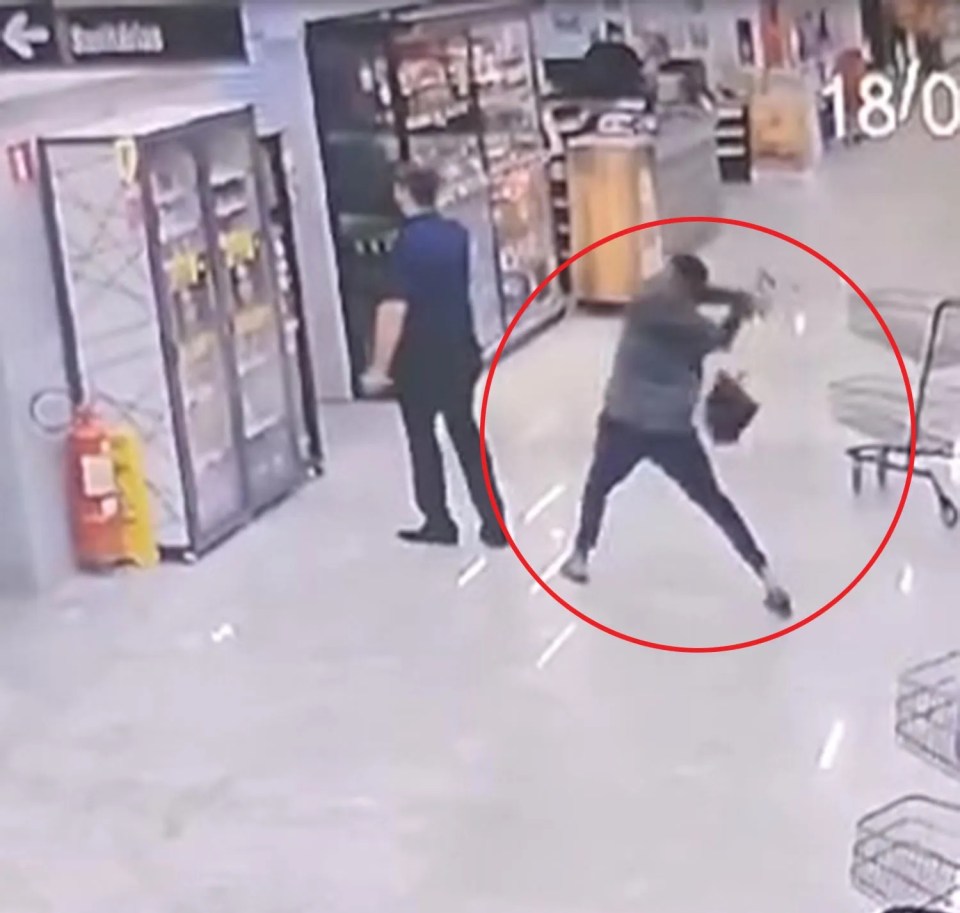 CCTV footage of a man hitting another man in the head with a shovel in a supermarket.