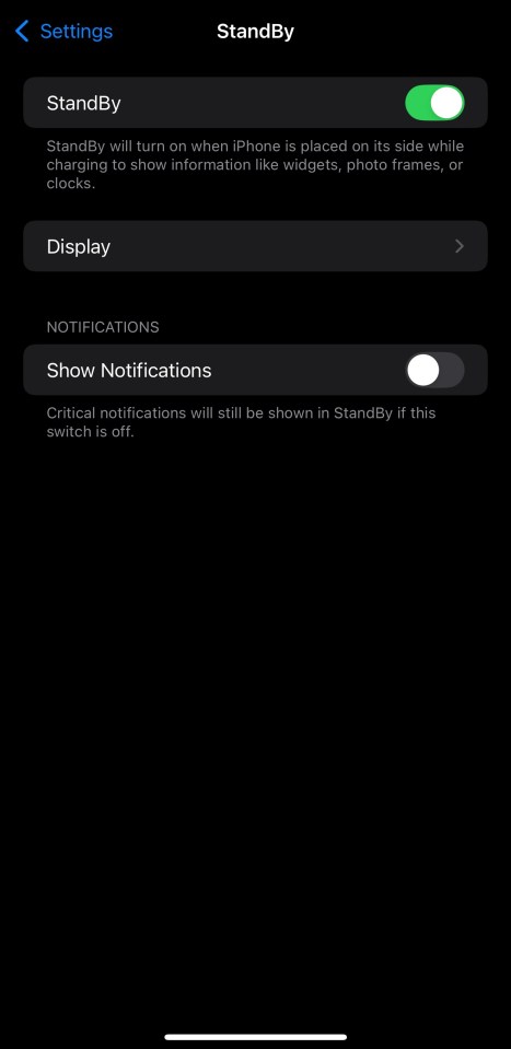 StandBy can be toggled on in Settings, and then activated by laying the iPhone on its side while it's charging