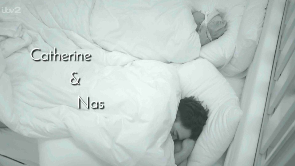 Catherine and Nas sleeping in bed.