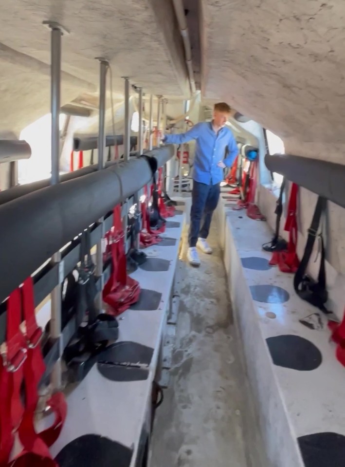 Interior of an oil rig lifeboat converted into a tiny home.