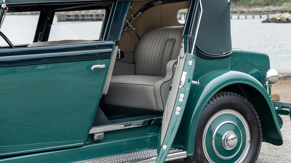 It features a teal exterior with leather insides