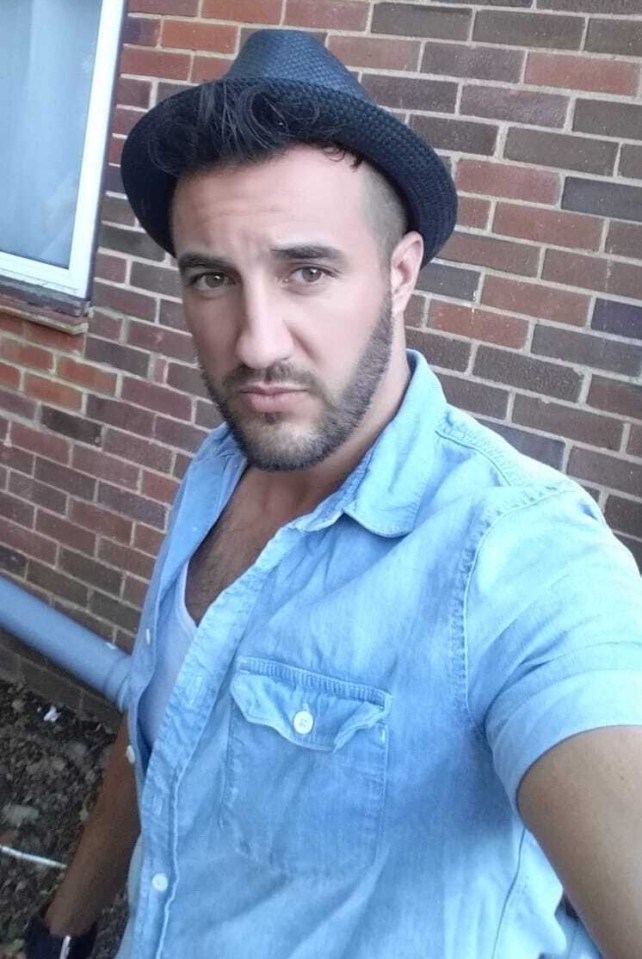 Man in a blue shirt and hat.