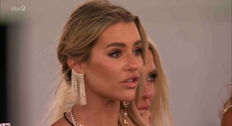 Screenshot from Love Island showing a woman looking upset.