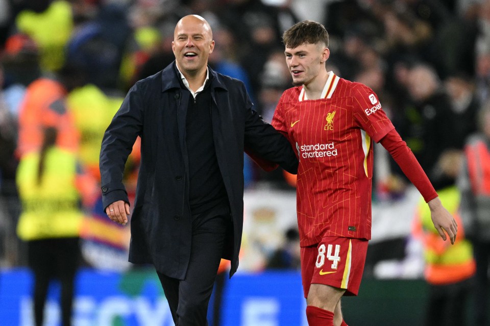 Conor Bradley and Liverpool's manager celebrating after a Champions League match.