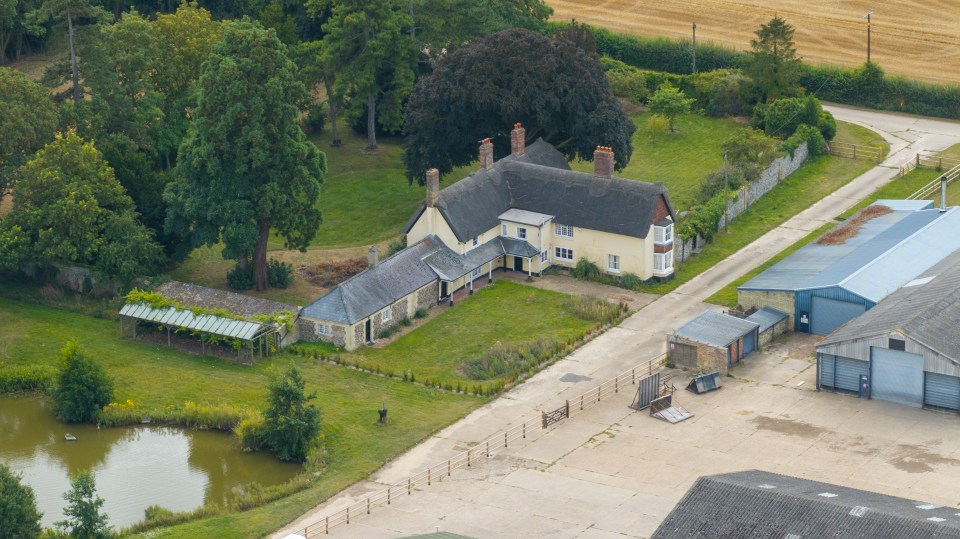 Aerial view of a 17th-century farmhouse in Cambridgeshire being converted into a luxury holiday rental.