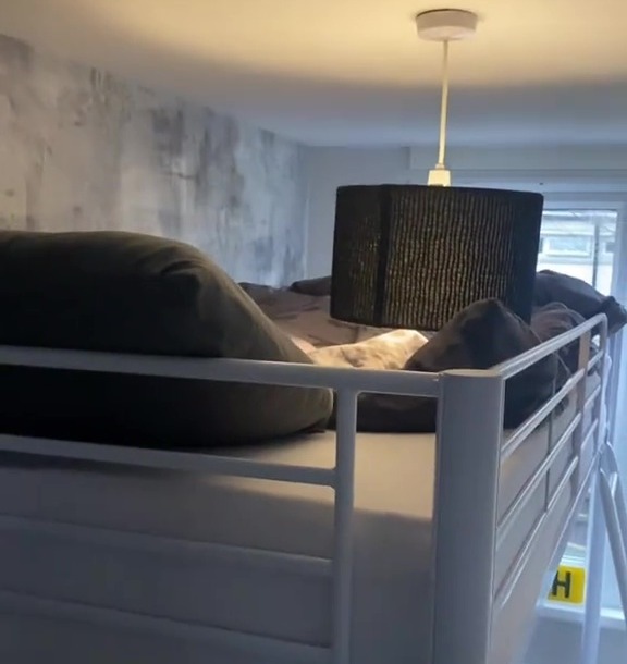 A high loft bed in a child's bedroom.