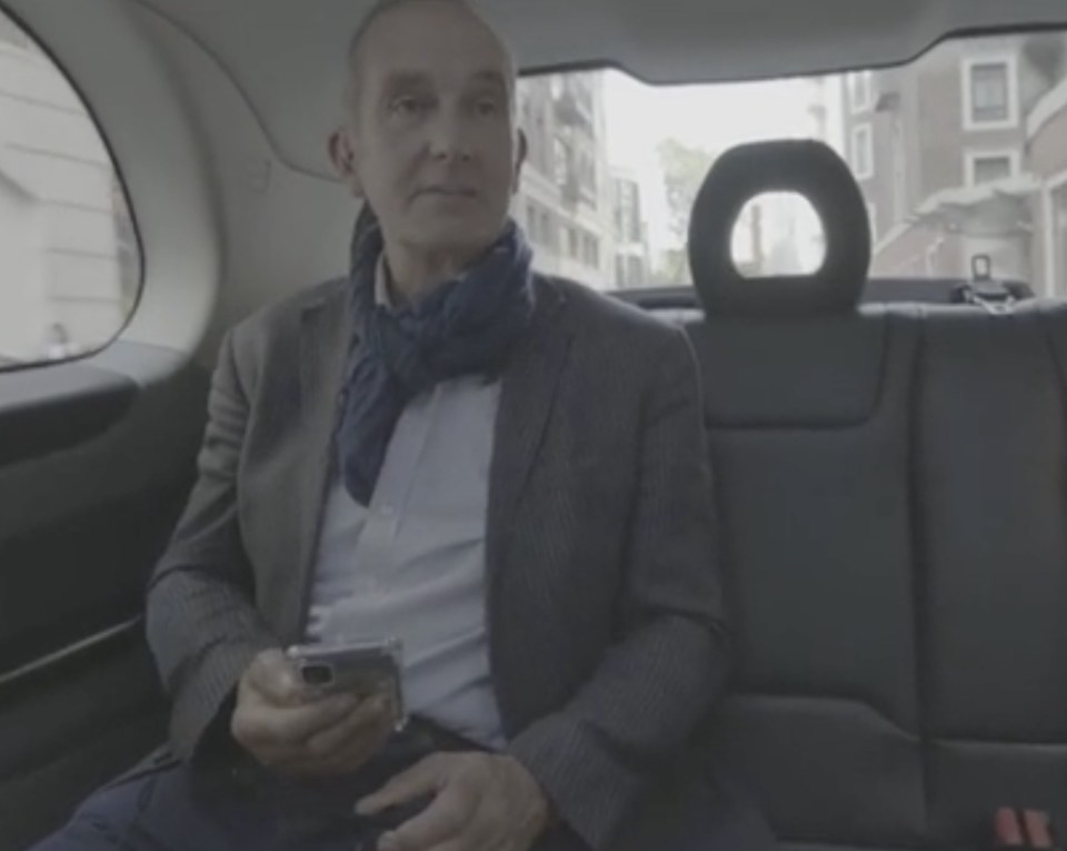 Kevin McCloud in a car.