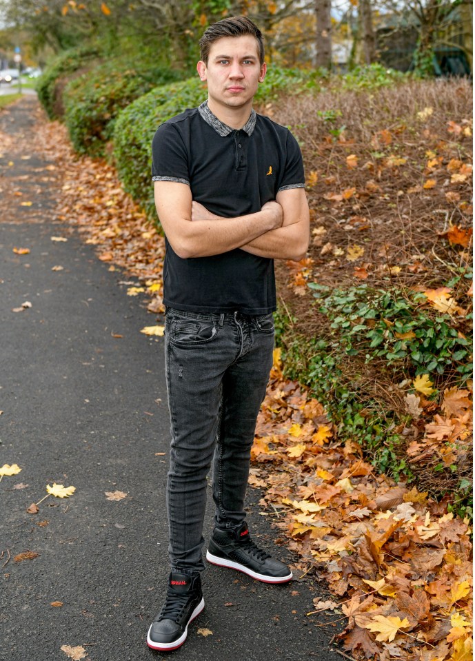 Man standing with arms crossed.