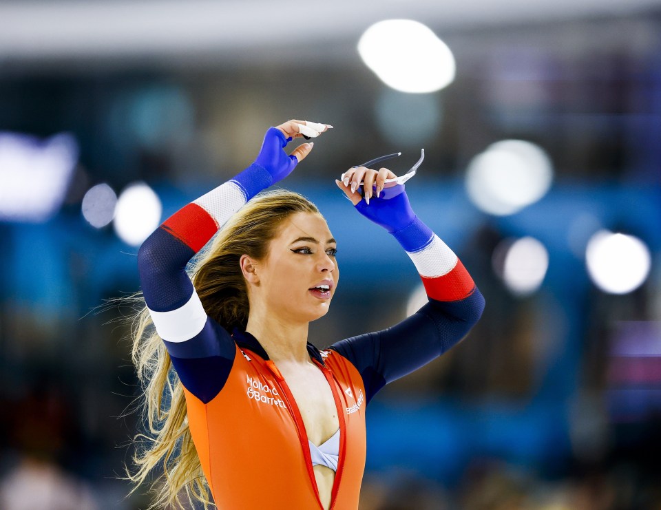 Jutta Leerdam reacts after winning a speed skating sprint title.