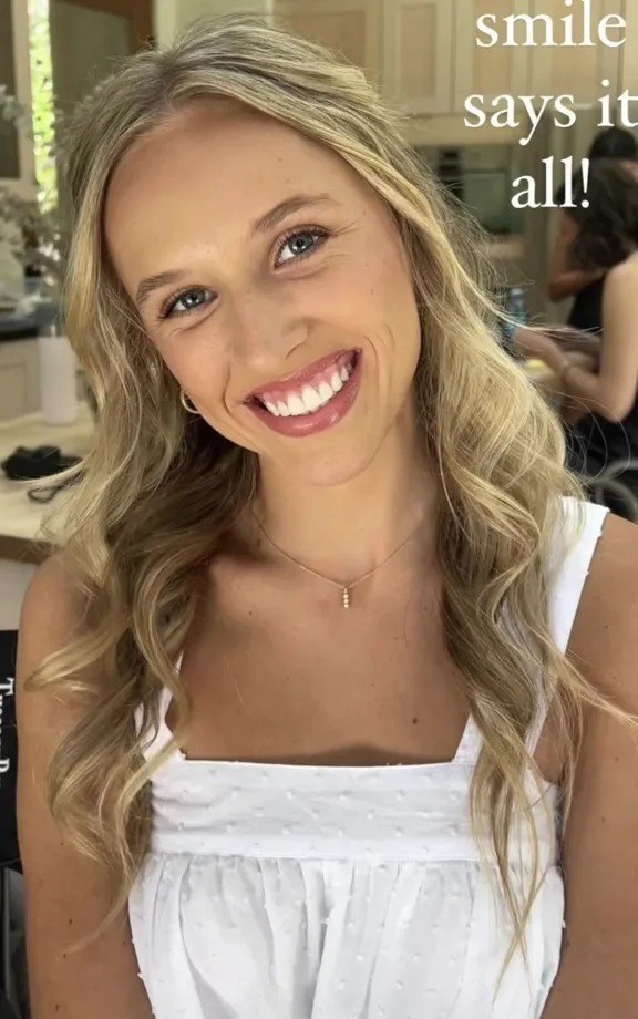 Bride washes off makeup before wedding.