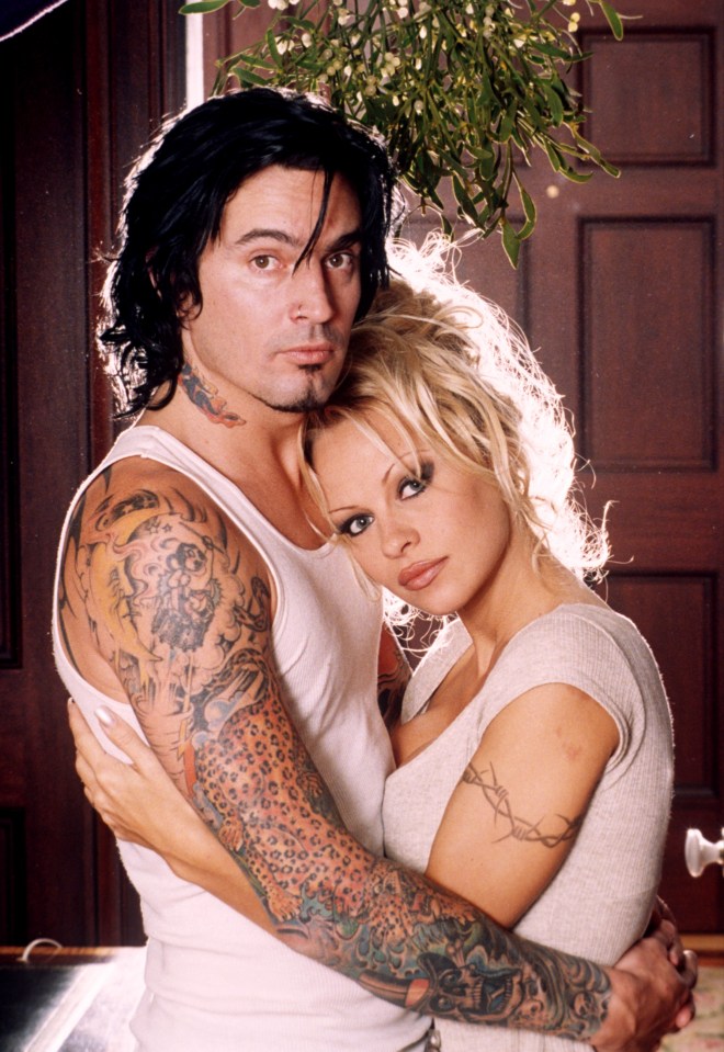 Pamela Anderson and Tommy Lee embracing.