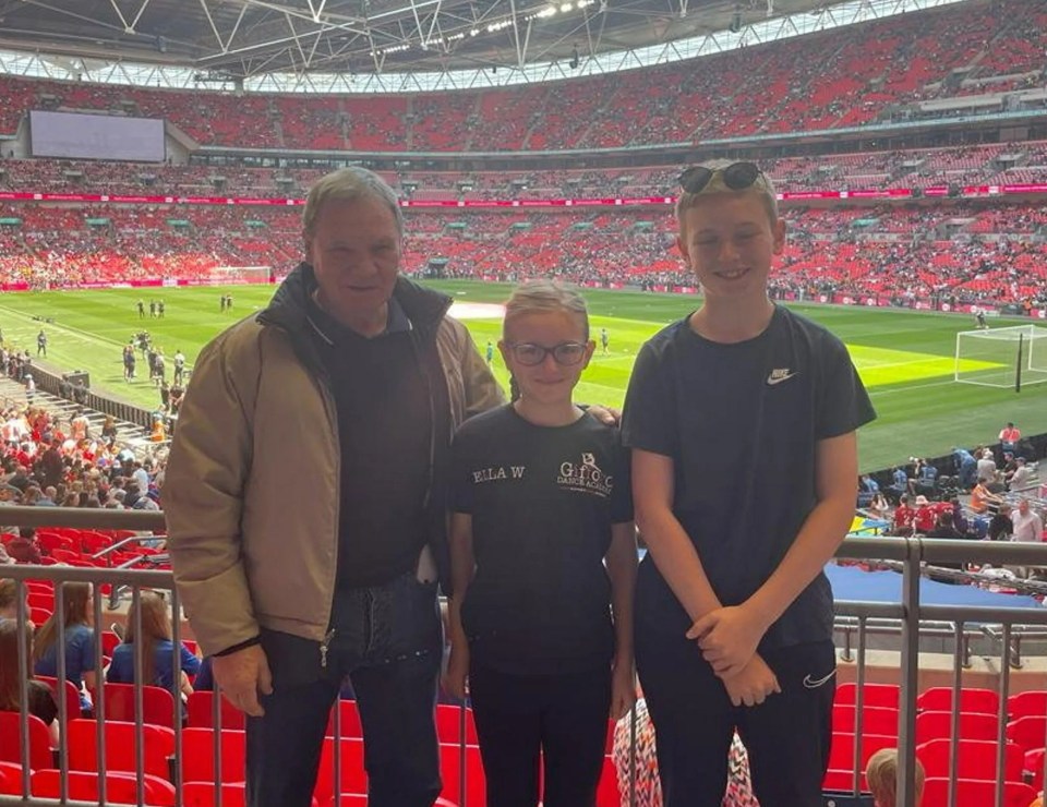 Steven, with his grandkids, Tommy and Ella at the football