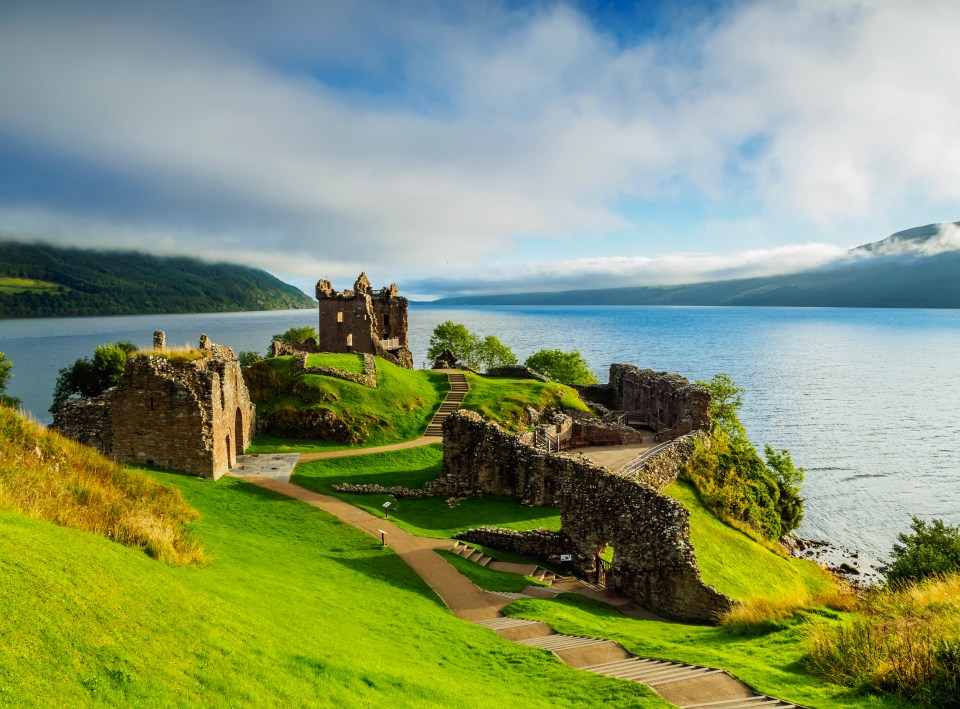 Urquhart Castle ruins overlooking Loch Ness in the Scottish Highlands.