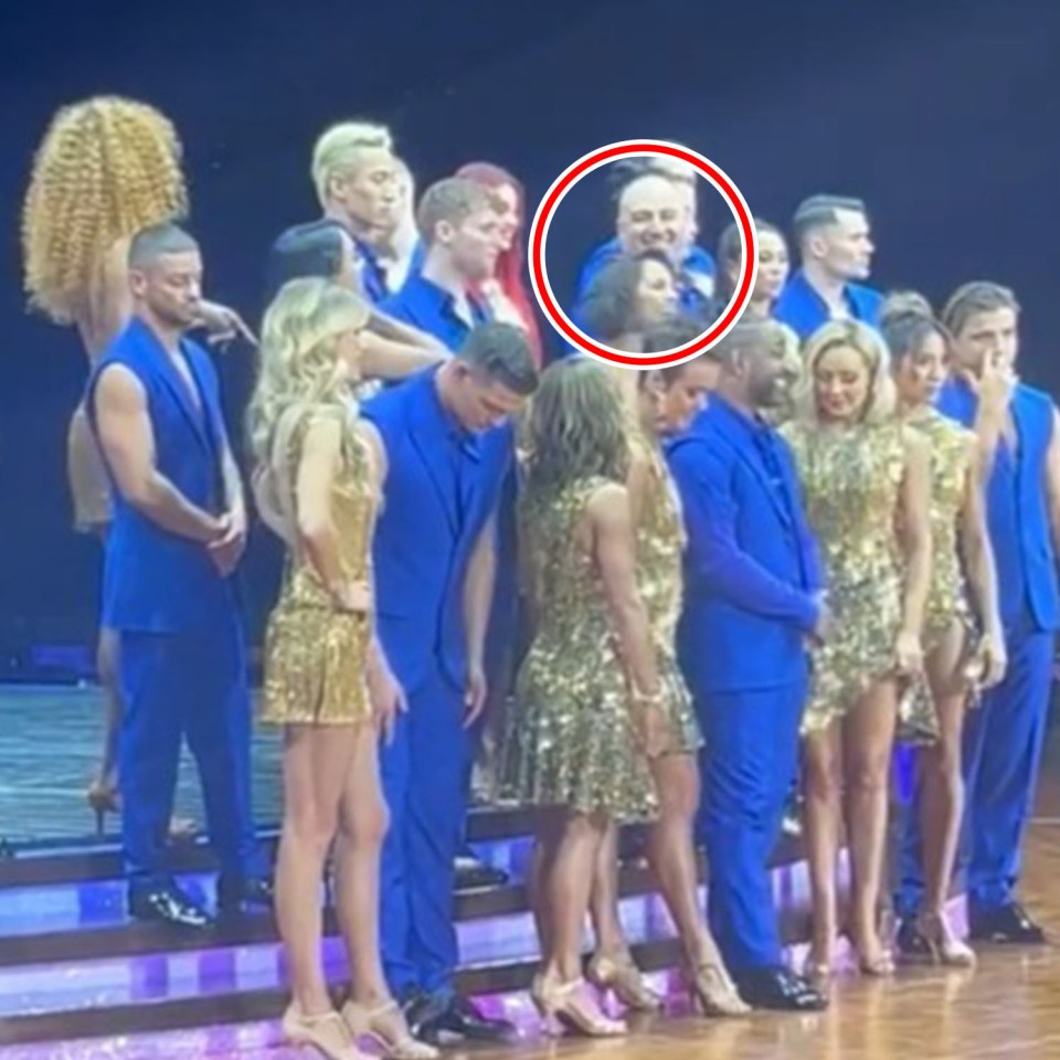 Group photo of dancers in gold and blue costumes.