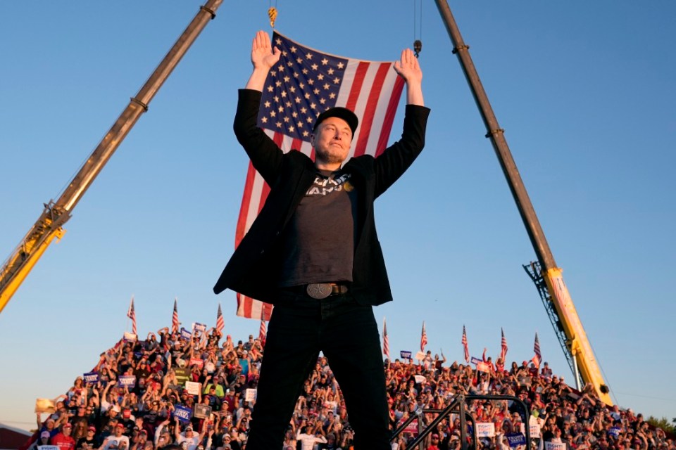 Tesla and SpaceX CEO Elon Musk walks to the stage to speak alongside Donald Trump