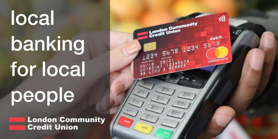 A hand using a London Community Credit Union Mastercard debit card at a point-of-sale terminal.