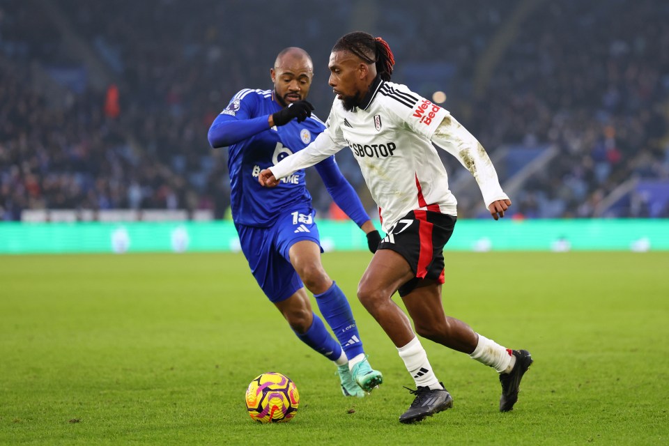 LEICESTER, ENGLAND - JANUARY 18: Alex Iwobi of Fulham runs with the ball whilst under pressure from Jordan Ayew of Leicester City during the Premier League match between Leicester City FC and Fulham FC at The King Power Stadium on January 18, 2025 in Leicester, England. (Photo by Marc Atkins/Getty Images)