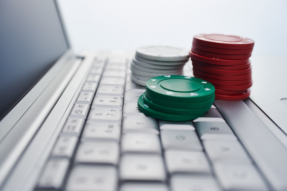 Gambling chips on computer keyboard