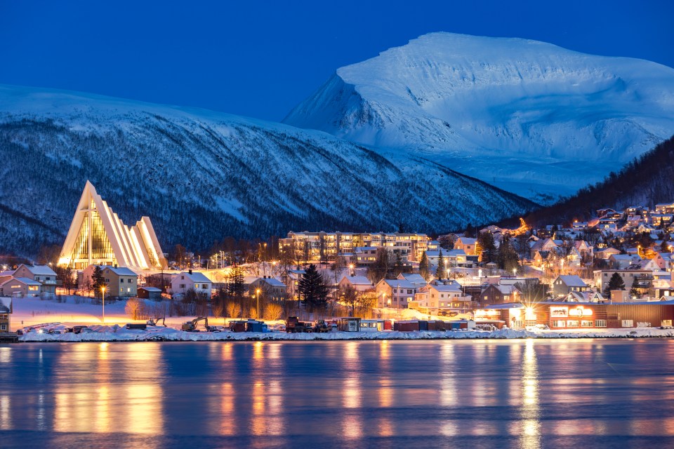 Arctic Cathedral and homes overlooking the water in Tromso