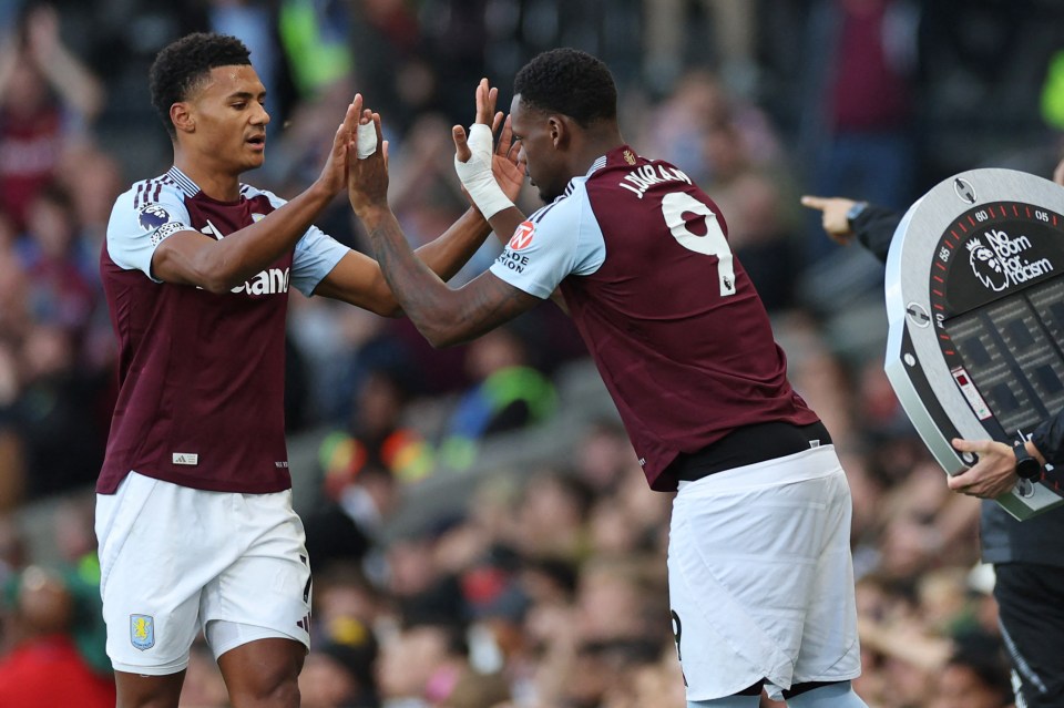 Aston Villa's Ollie Watkins and Jhon Duran high-five during a substitution.